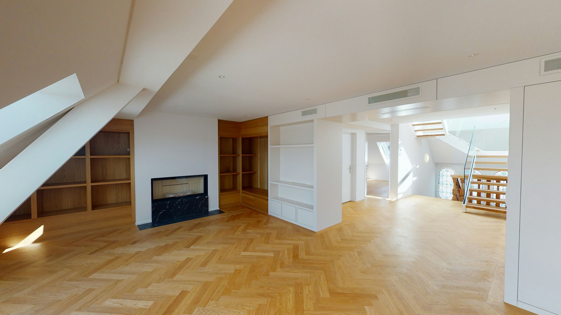 Herringbone pattern hardwood flooring installed in a home